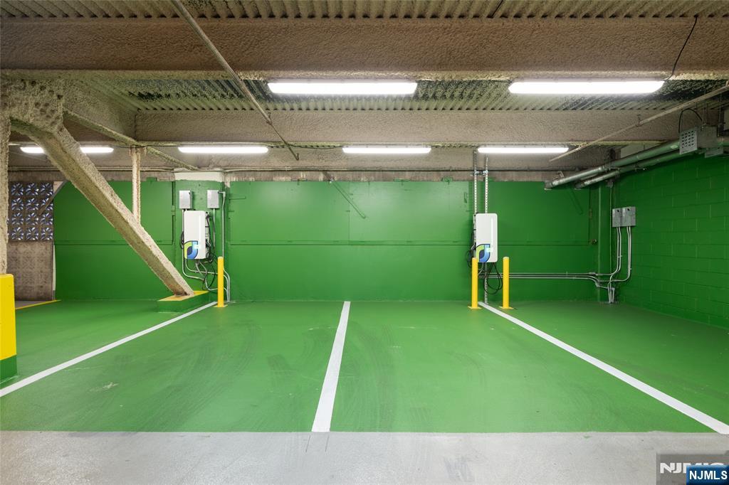 250 Gorge Road, Unit 23A Cliffside Park, NJ 07010 - Photo 32 of 41 a backyard with a table and chairs