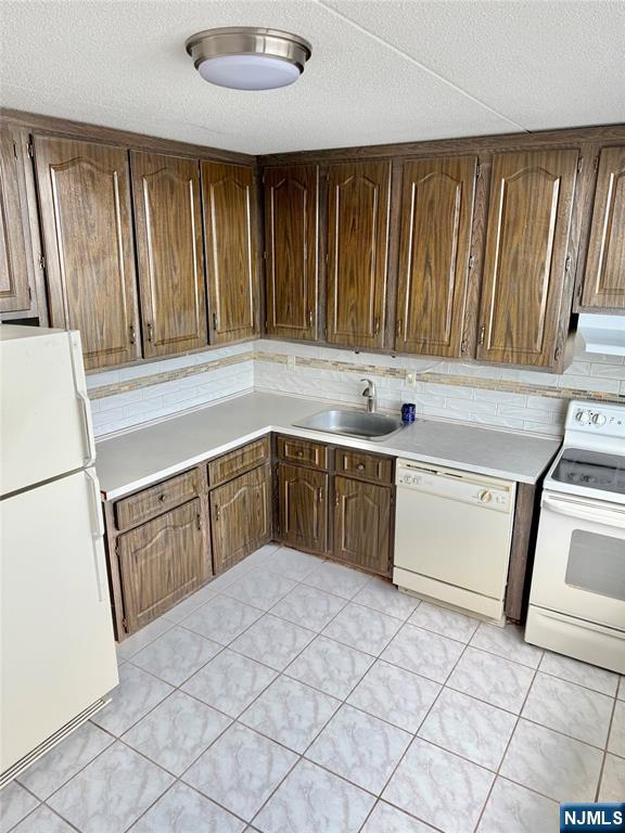 250 Gorge Road, Unit 23A Cliffside Park, NJ 07010 - Photo 5 of 41 a kitchen with a cabinets and white stainless steel appliances
