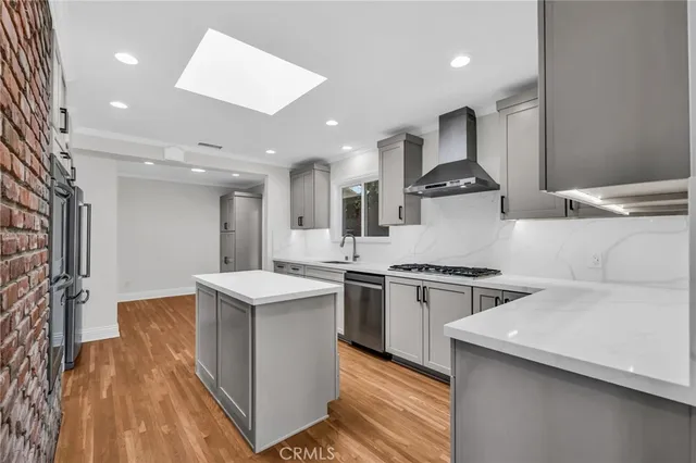 a kitchen that has a stove and a microwave