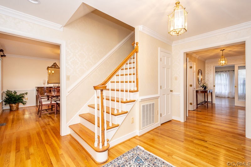 Open foyer with 1 set of stairs to 2nd floor, hard