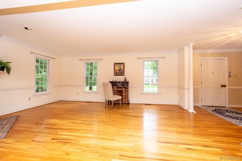 Formal Living Room with hardwood floor, crown mold