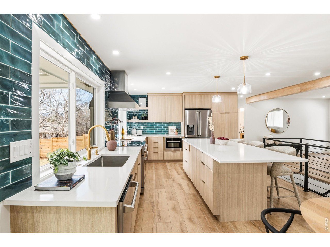 7750 Durham Way Boulder, CO 80301 - Photo 11 of 32 a large kitchen with kitchen island a large window in it