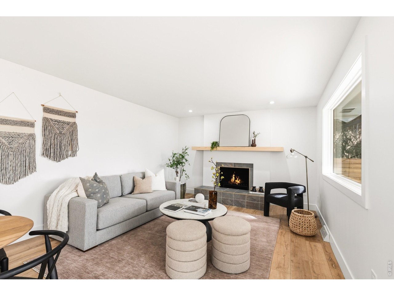 7750 Durham Way Boulder, CO 80301 - Photo 13 of 32 a living room with furniture a fireplace and window