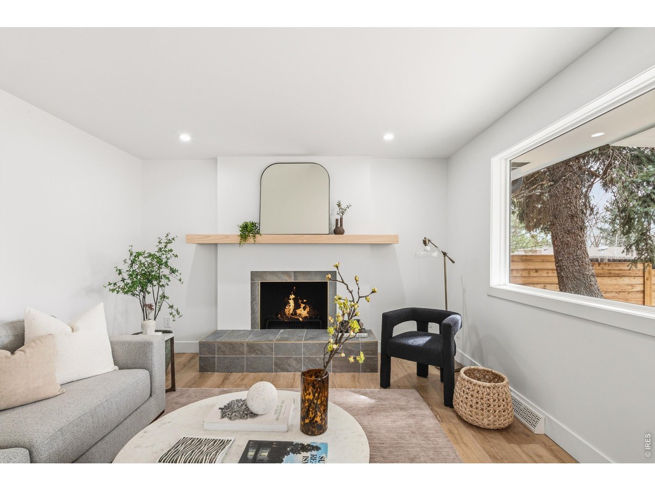 7750 Durham Way Boulder, CO 80301 - Photo 14 of 32 a living room with furniture a window and a fireplace