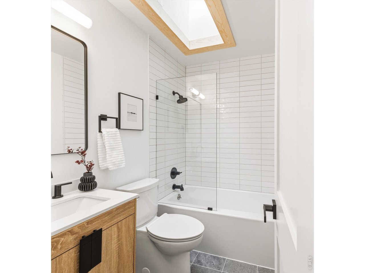 7750 Durham Way Boulder, CO 80301 - Photo 15 of 32 a bathroom with a sink a toilet and shower curtain