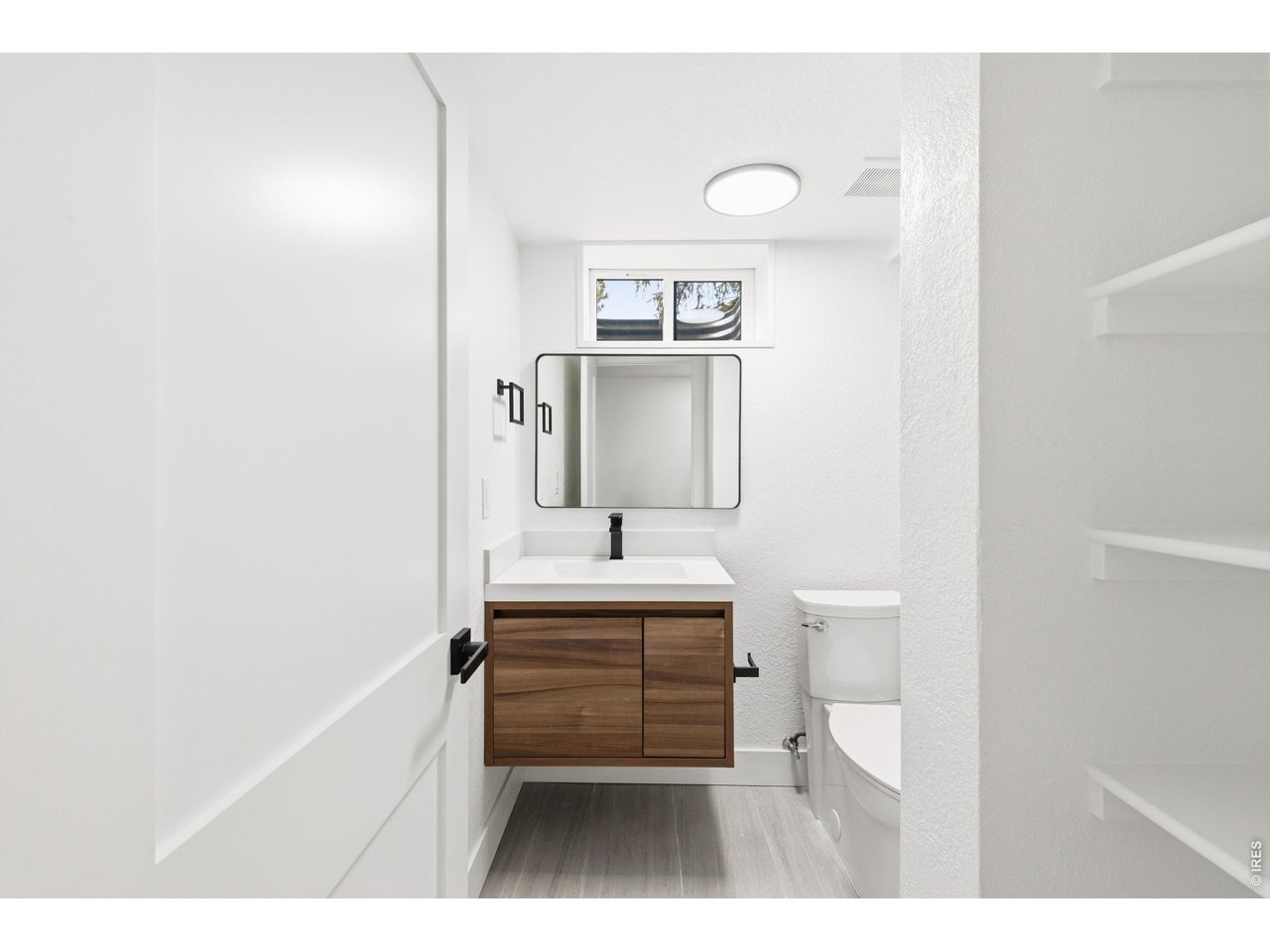 7750 Durham Way Boulder, CO 80301 - Photo 25 of 32 a bathroom with a sink a toilet and mirror
