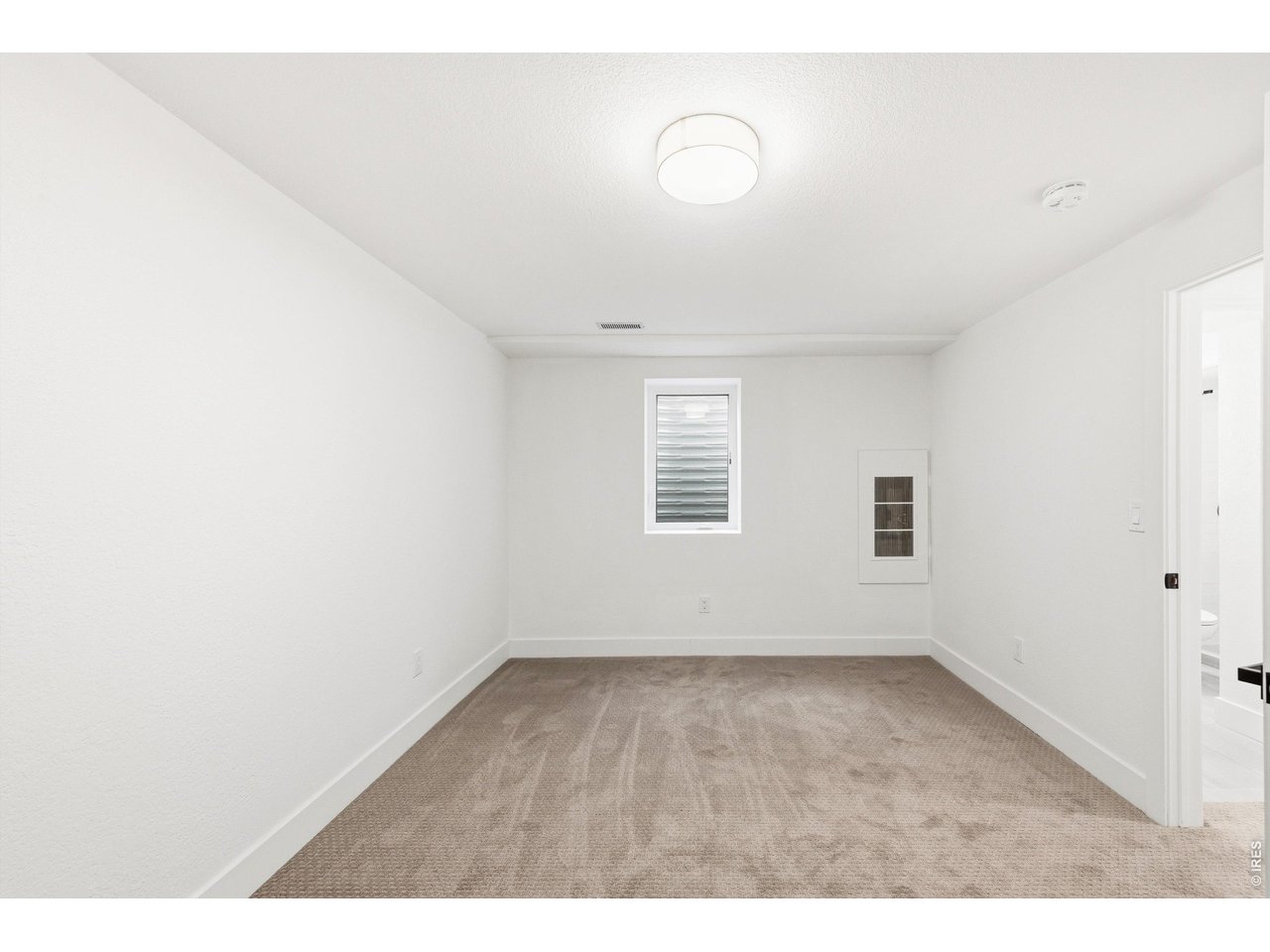 7750 Durham Way Boulder, CO 80301 - Photo 27 of 32 a view of an empty room with a window
