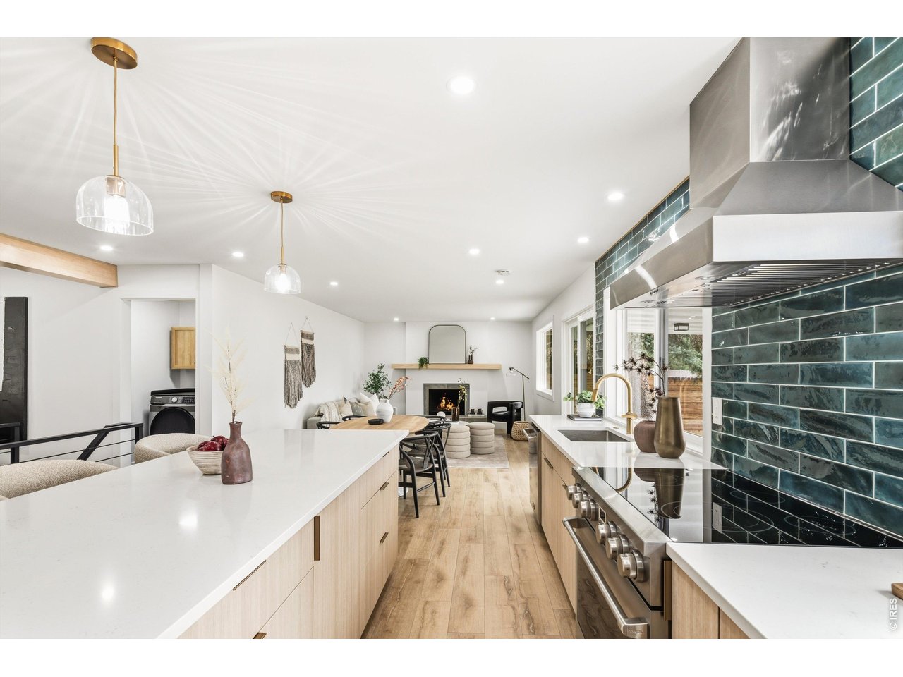 7750 Durham Way Boulder, CO 80301 - Photo 10 of 32 a kitchen with stainless steel appliances kitchen island granite countertop a sink and cabinets