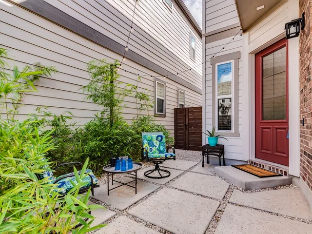 a view of a potted plants in front of a house