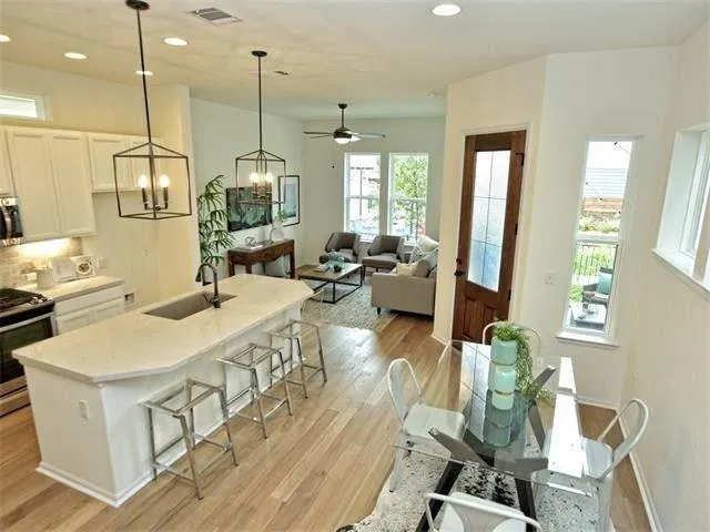 a very nice looking dining room with a large window
