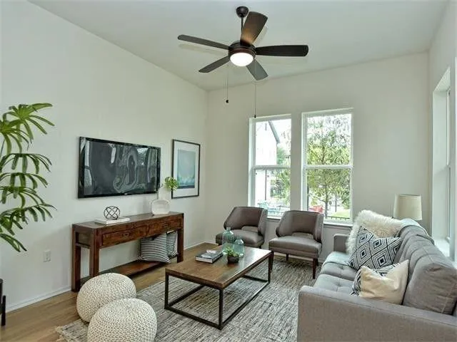 a living room with furniture and a flat screen tv