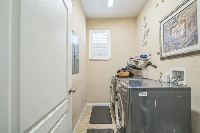 a room with a sink and a washer