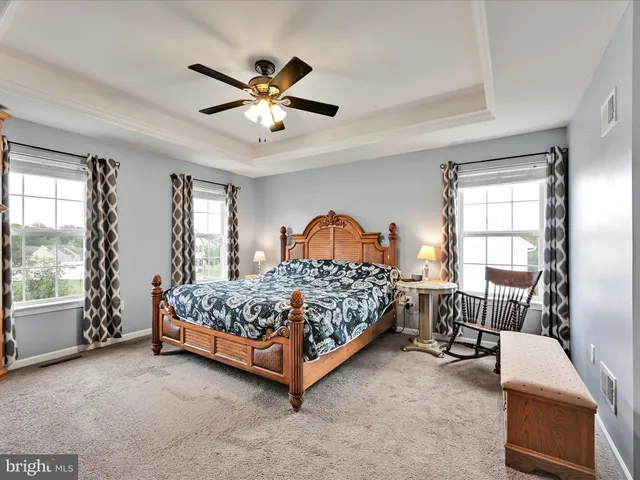 a bedroom with a bed and a television