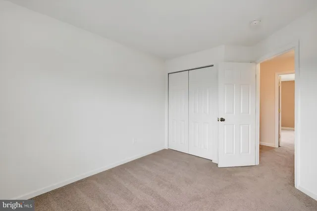 a bathroom with a sink a toilet and shower curtain