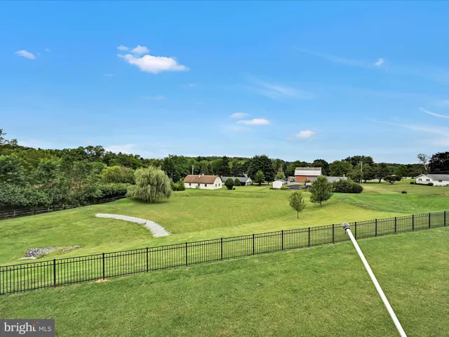 a view of outdoor space with garden and trees