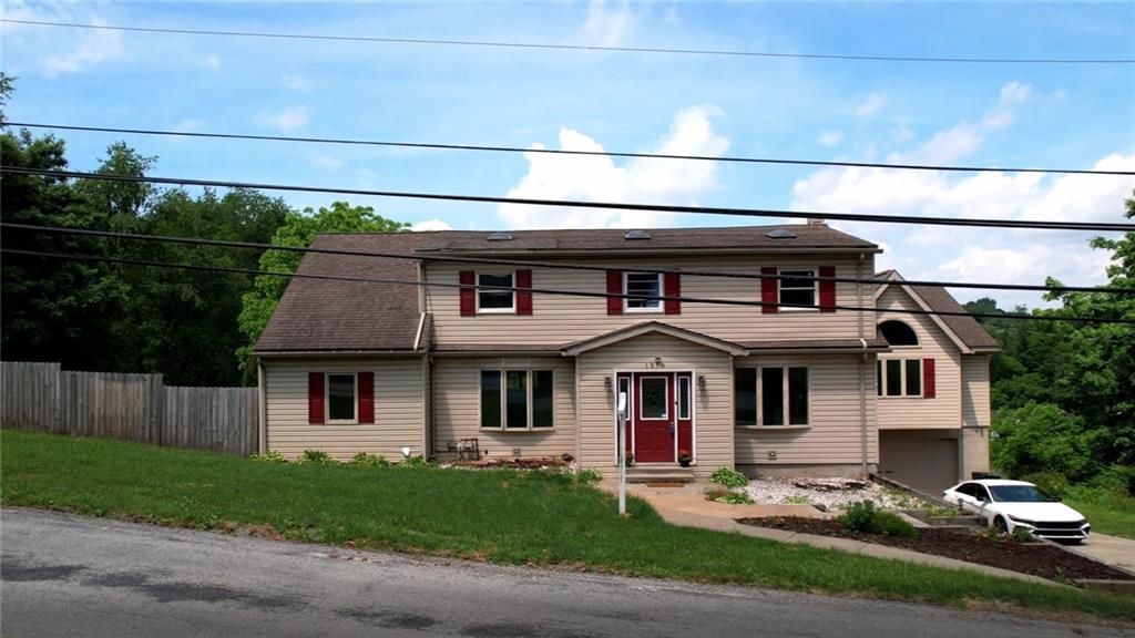 1378 Robbins Station Road Irwin, PA 15642 - Photo 2 of 50 a front view of a house with a yard and garage