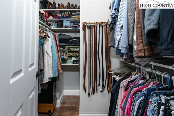 a bedroom with bed and a couch