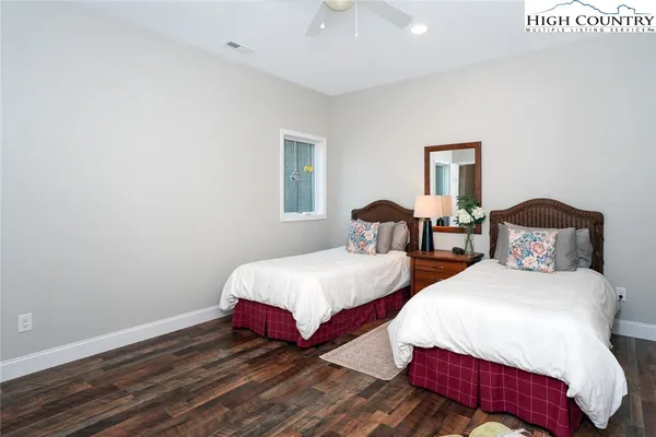 a bedroom with a bed and a couch