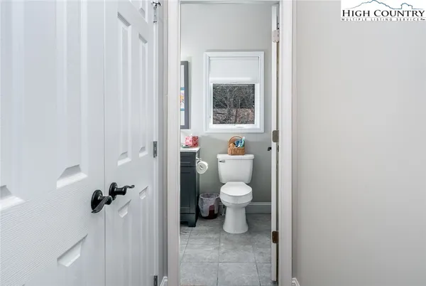 a bathroom with a shower curtain and a sink