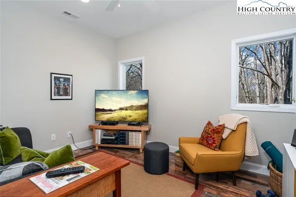 a view of a patio with table and chairs