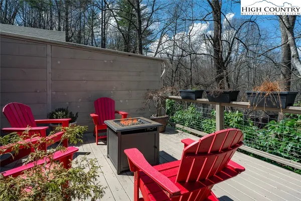 a sitting area with furniture and wooden deck