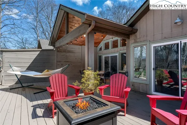 a view of a chairs and table in the patio