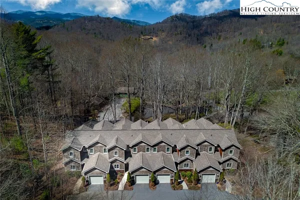 an aerial view of residential house with outdoor space and parking