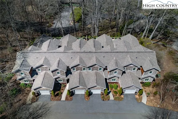 a front view of a house with garage