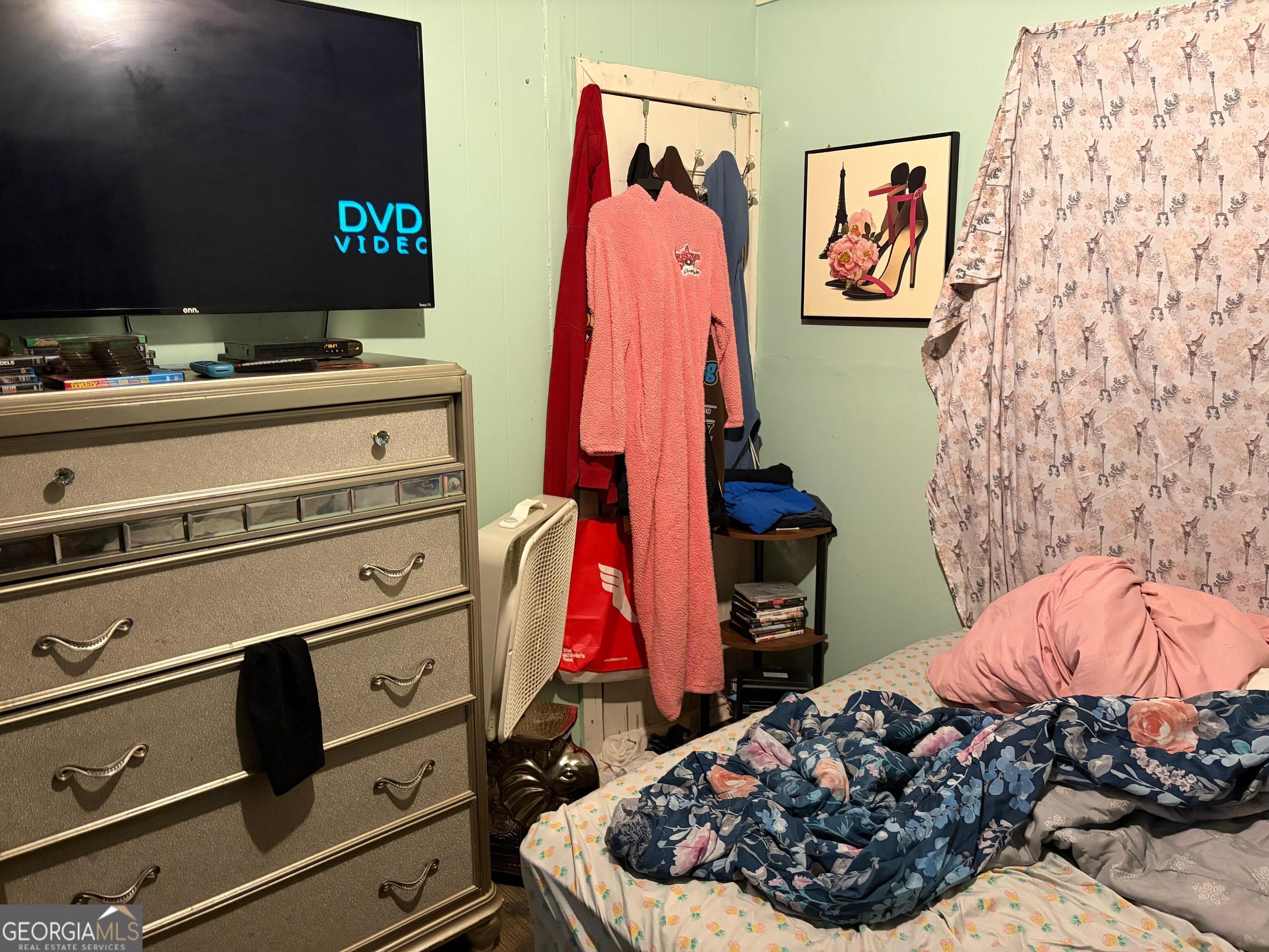 115 Rhodes Road Columbia, NC 27925 - Photo 13 of 20 a bed room with a bed and a couch