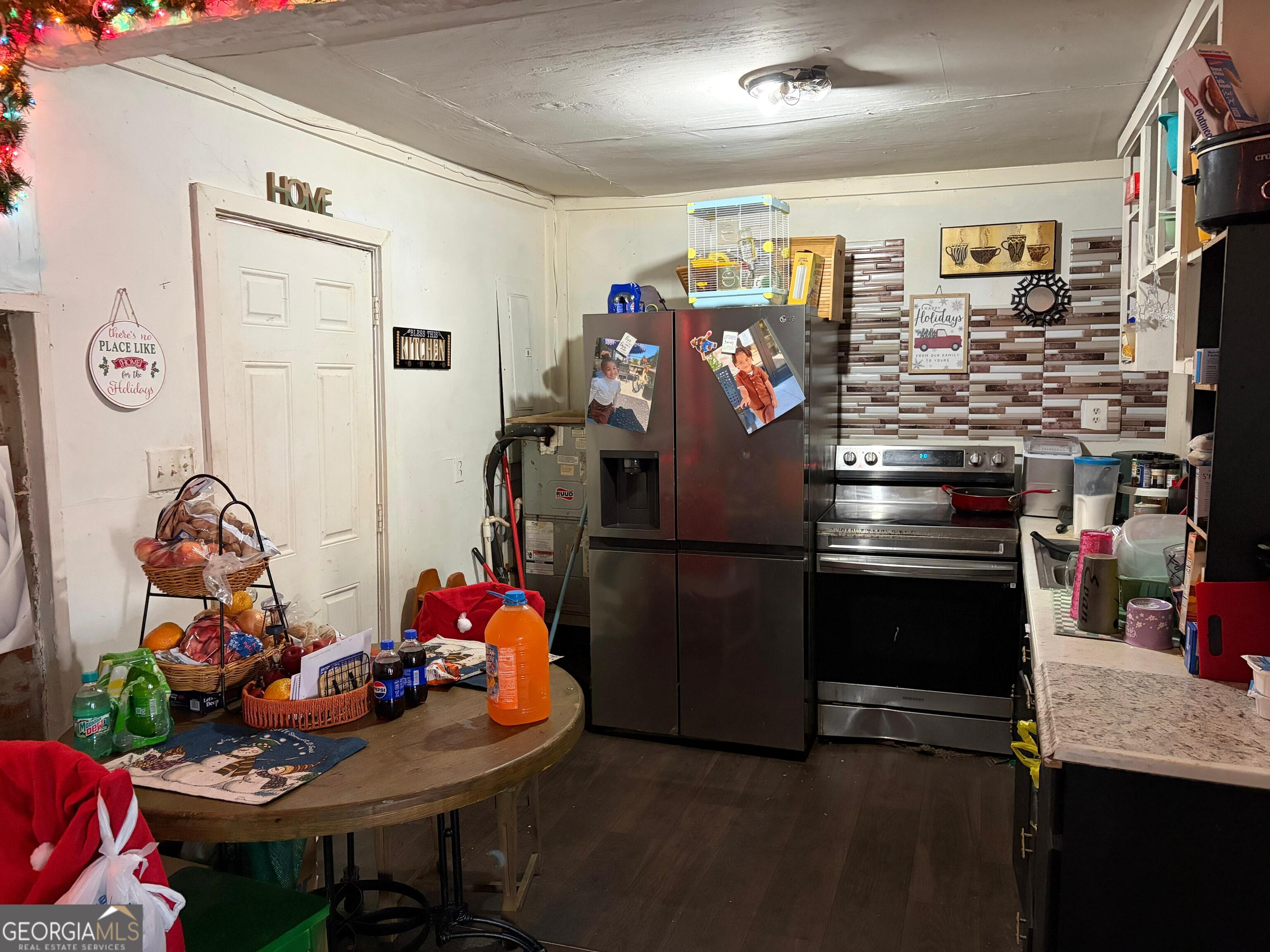 115 Rhodes Road Columbia, NC 27925 - Photo 4 of 20 a kitchen with stainless steel appliances kitchen island granite countertop a refrigerator and a stove
