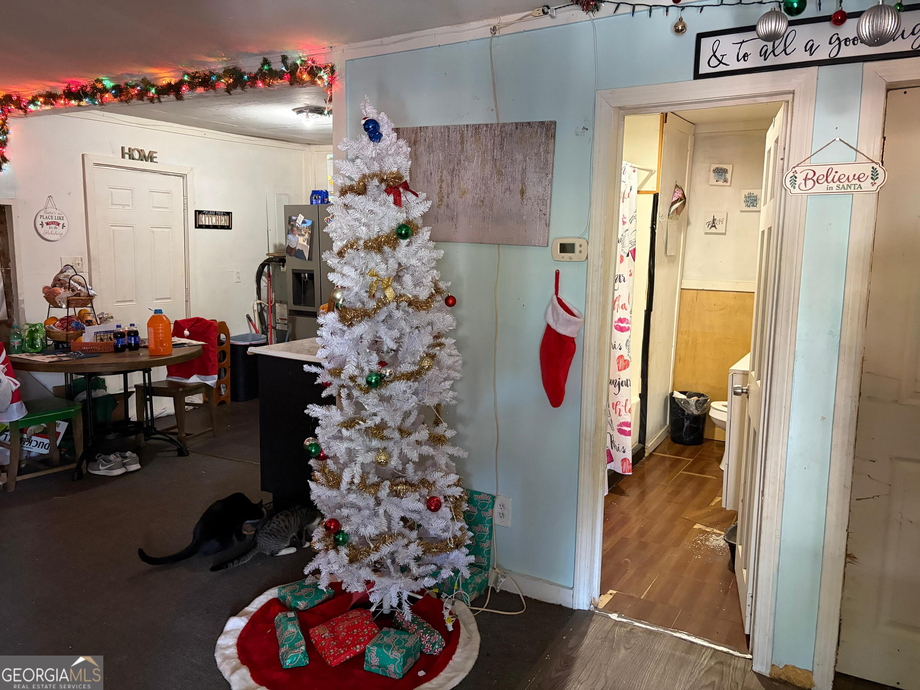 115 Rhodes Road Columbia, NC 27925 - Photo 6 of 20 a dining room with furniture and a chandelier