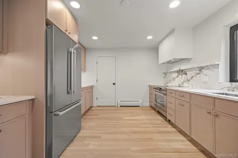 a bathroom with a sink a mirror and a shower