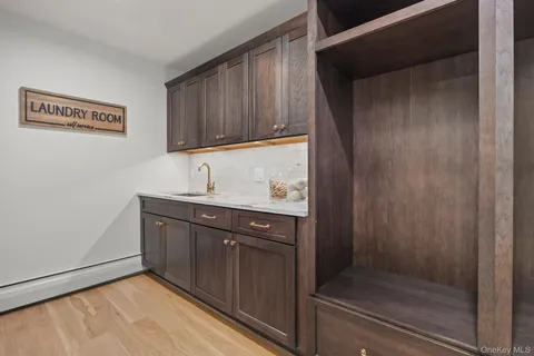 a kitchen with a sink and cabinets