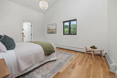 a bedroom with a bed and a table in it