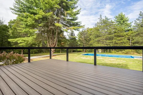 a view of swimming pool with seating space