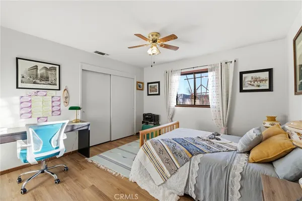 a bedroom with a large bed and a window