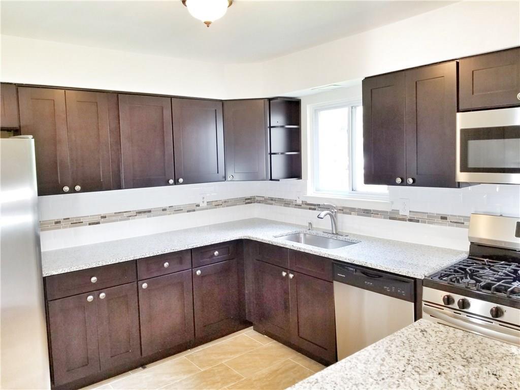 8503 Hana Road Edison, NJ 08817 - Photo 1 of 18 a kitchen with a sink and a stove top oven