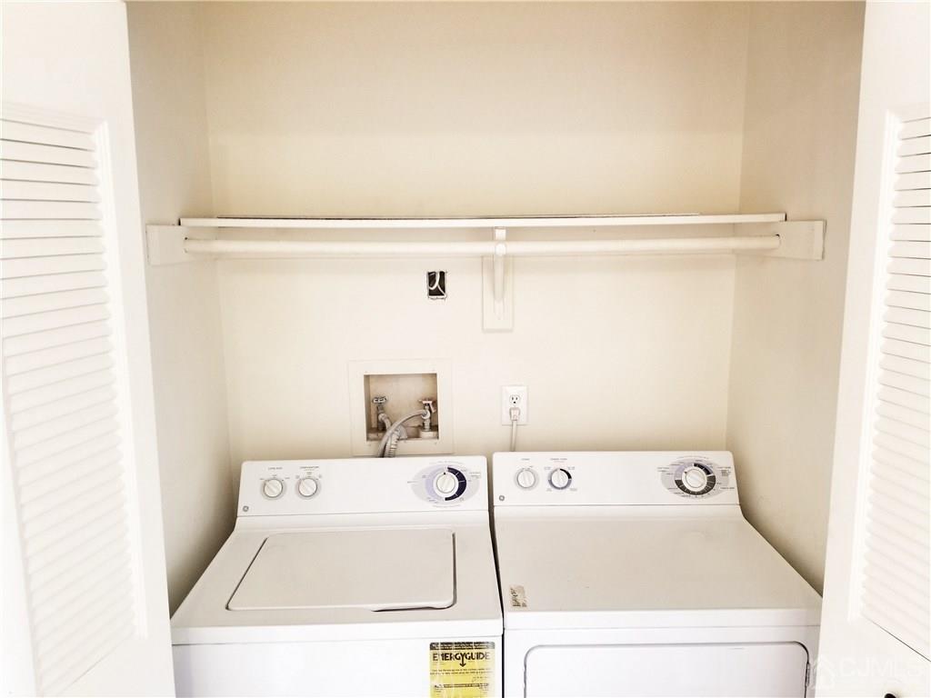 8503 Hana Road Edison, NJ 08817 - Photo 15 of 18 a utility room with dryer and washer