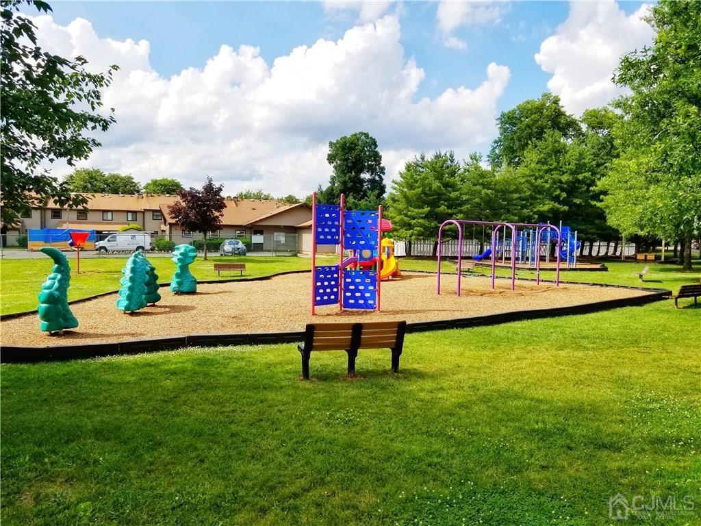 8503 Hana Road Edison, NJ 08817 - Photo 17 of 18 a view of a park with swings and slides
