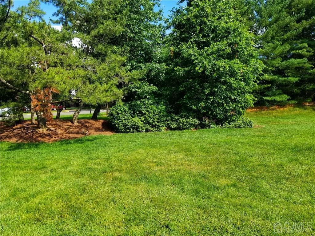 8503 Hana Road Edison, NJ 08817 - Photo 18 of 18 a backyard of a house with outdoor seating and green space