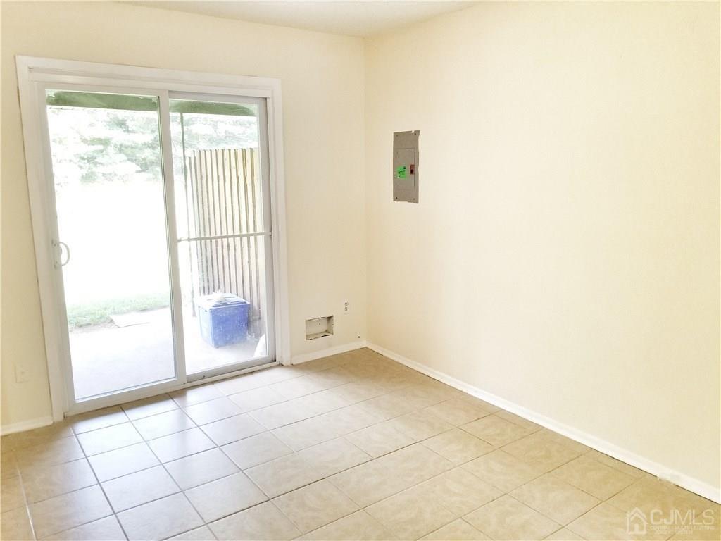 8503 Hana Road Edison, NJ 08817 - Photo 5 of 18 a view of an empty room and window