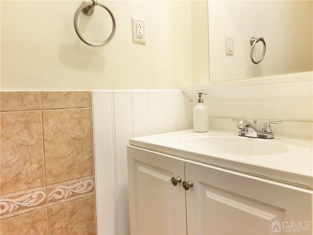 8503 Hana Road Edison, NJ 08817 - Photo 7 of 18 a bathroom with a sink and a mirror
