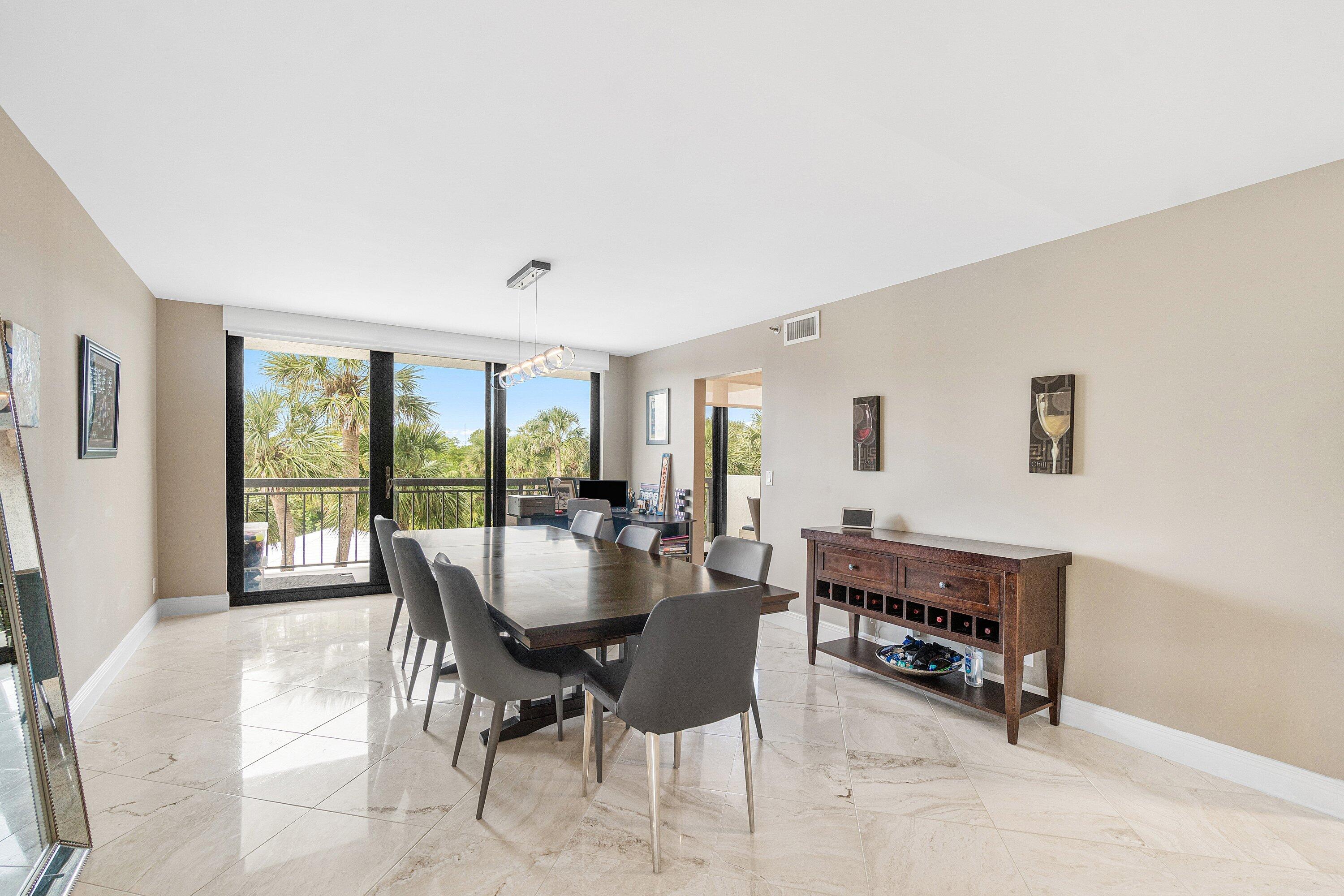 2001 North Ocean Boulevard, Unit 305 Boca Raton, FL 33431 - Photo 20 of 61 a dining room with furniture and window