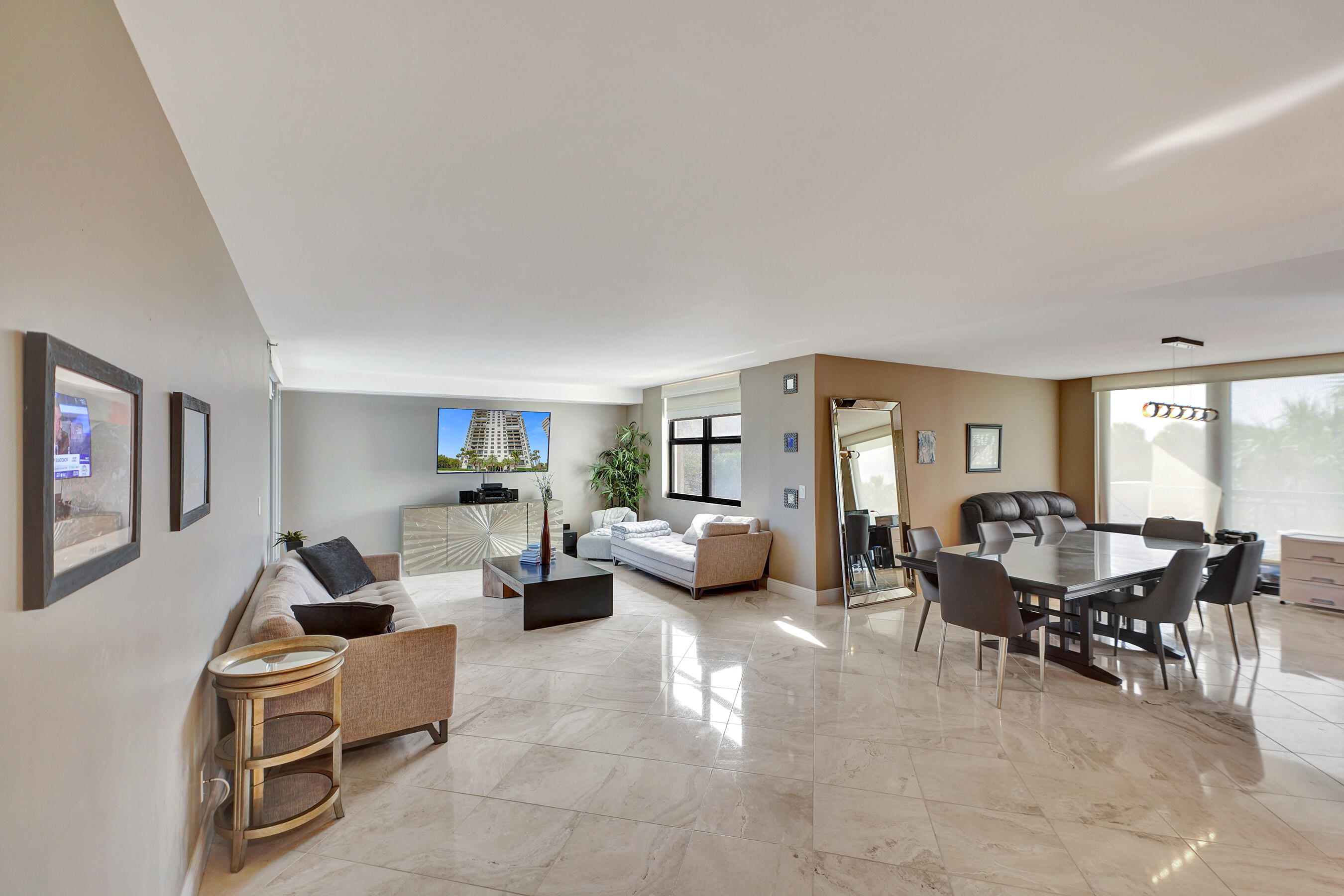 2001 North Ocean Boulevard, Unit 305 Boca Raton, FL 33431 - Photo 61 of 61 a living room with furniture and a large window