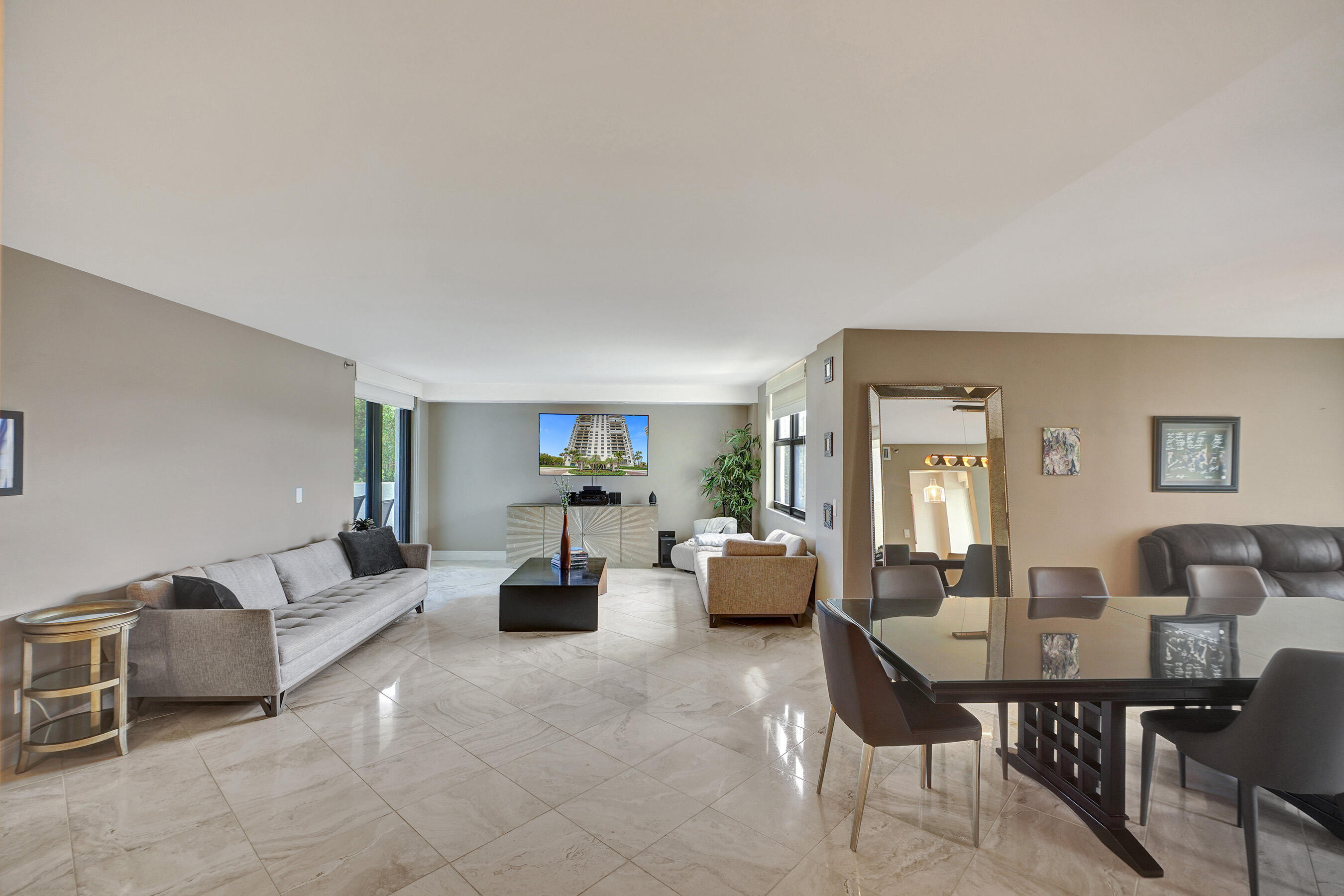 2001 North Ocean Boulevard, Unit 305 Boca Raton, FL 33431 - Photo 22 of 61 a living room with furniture dining table and a couch