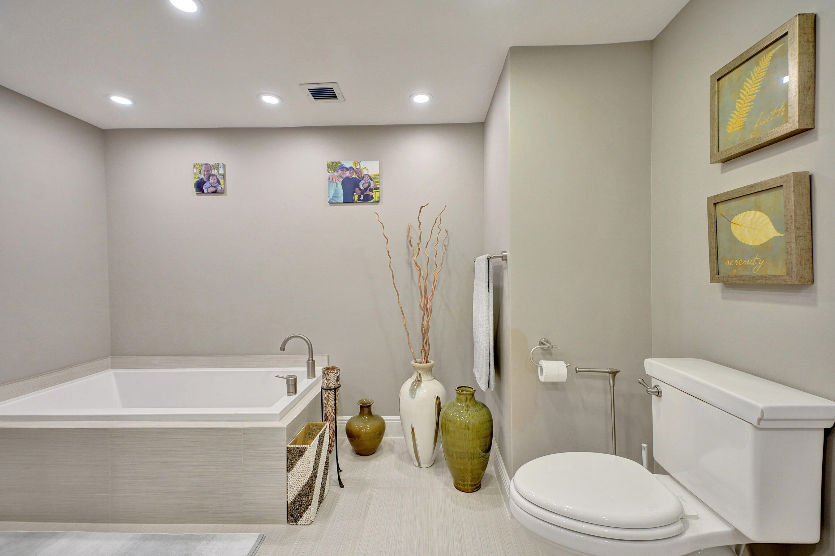 2001 North Ocean Boulevard, Unit 305 Boca Raton, FL 33431 - Photo 40 of 61 a bathroom with a sink a toilet and tub