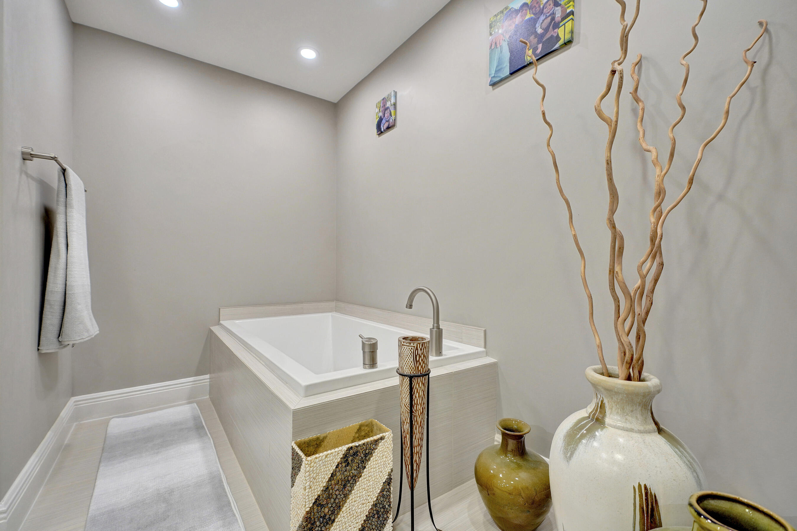 2001 North Ocean Boulevard, Unit 305 Boca Raton, FL 33431 - Photo 41 of 61 a bathroom with a bathtub