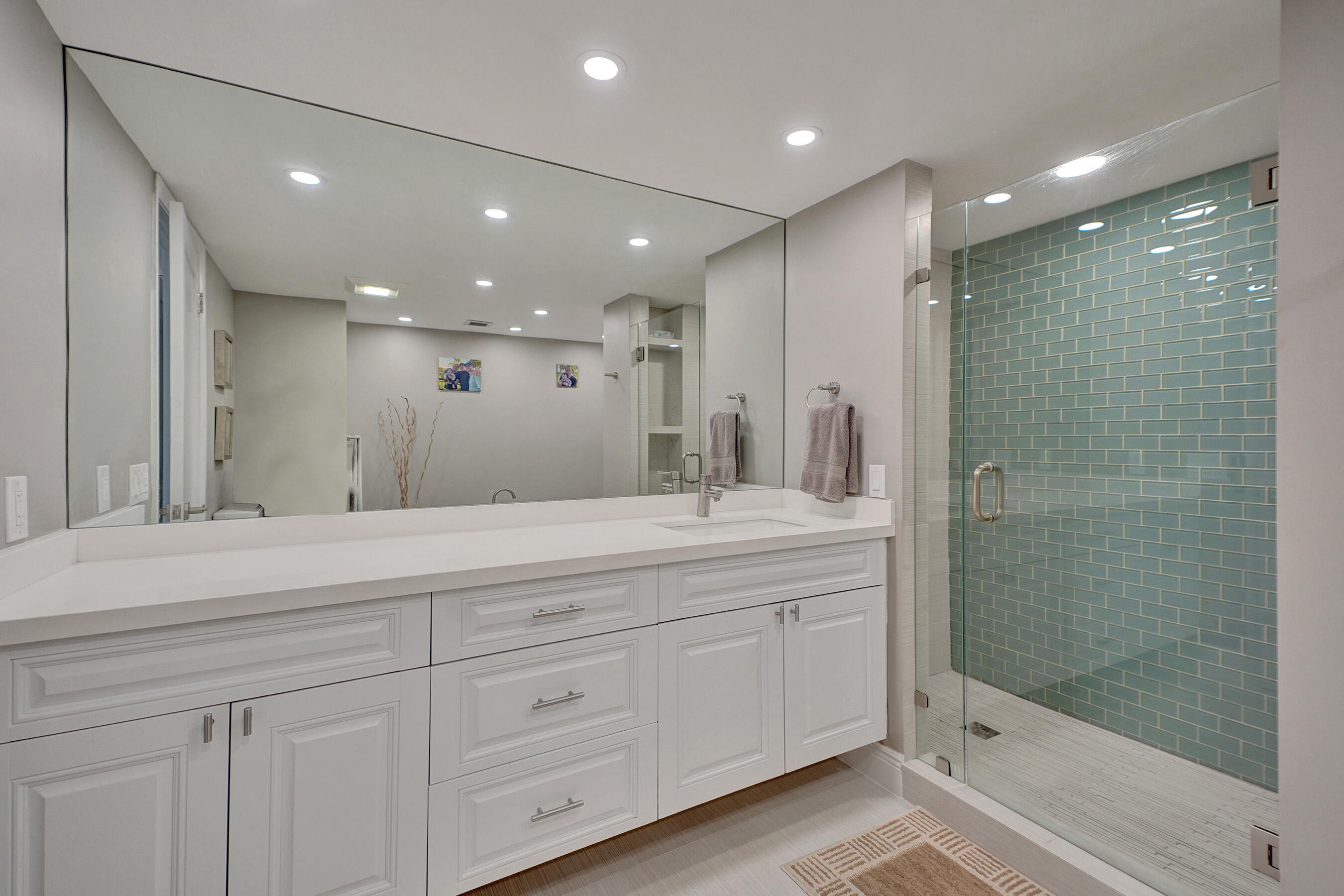 2001 North Ocean Boulevard, Unit 305 Boca Raton, FL 33431 - Photo 42 of 61 a bathroom with a double vanity sink and mirror
