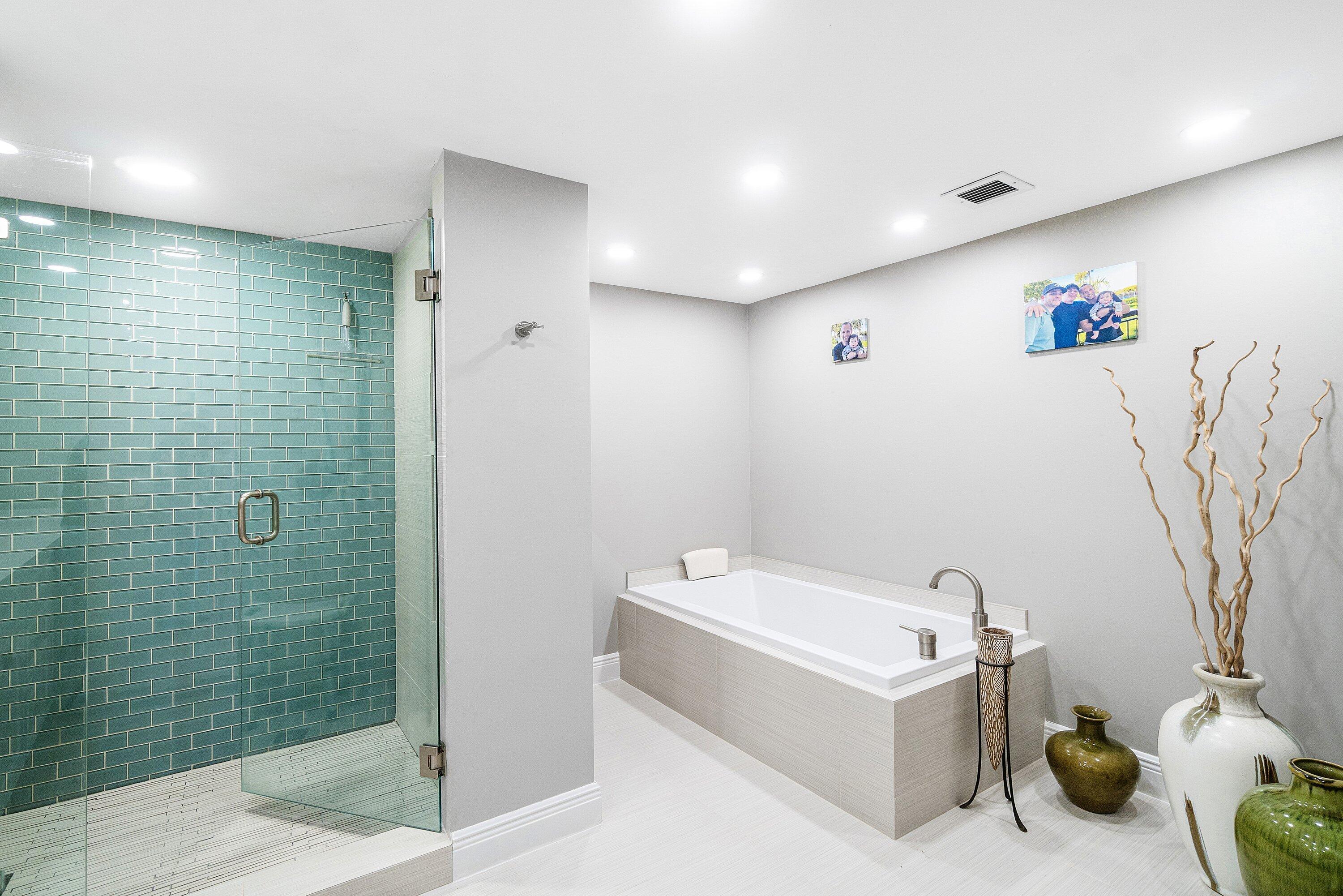 2001 North Ocean Boulevard, Unit 305 Boca Raton, FL 33431 - Photo 46 of 61 a bathroom with a tub and a shower