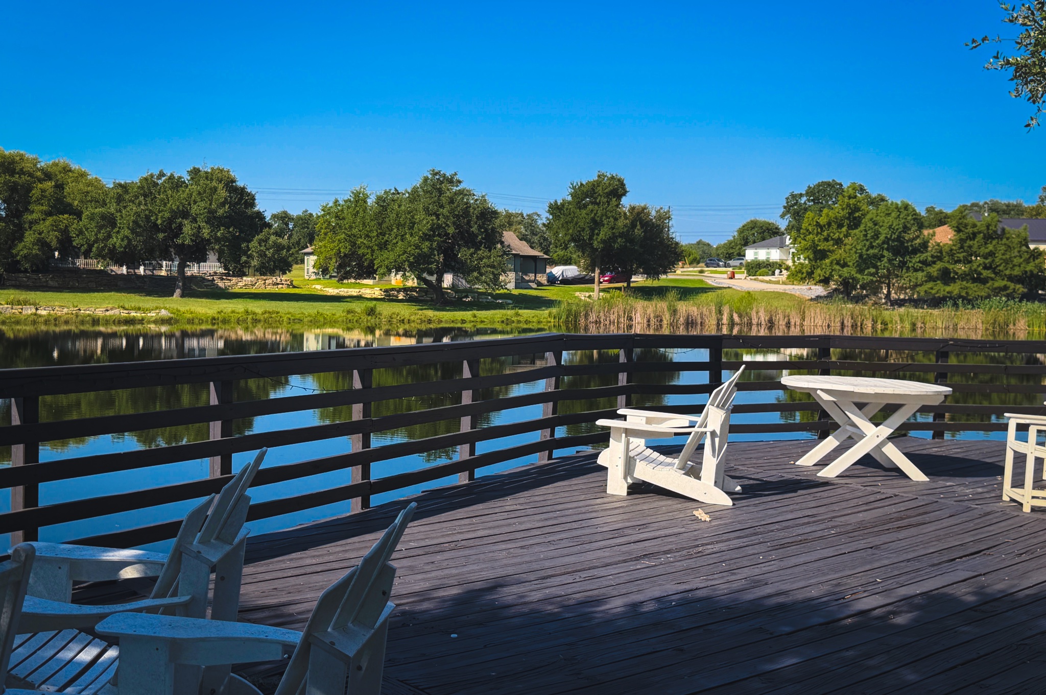Lot 380 South Calvin Barrett Road Blanco, TX 78606 - Photo 23 of 24 A spacious wood deck offers peaceful lake views and a serene outdoor retreat.